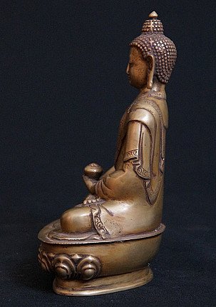 Bronze Buddha statue from India in seated posture, right side profile