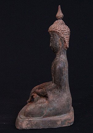 Burmese bronze Buddha statue, seated, side profile with tall ushnisha and elongated ear