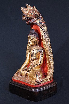 Shan Naga Buddha statue in lacquerware, three-quarter view showing the naga head canopy