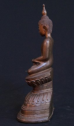 Burmese bronze Buddha statue in profile, seated posture with tall finial, left view