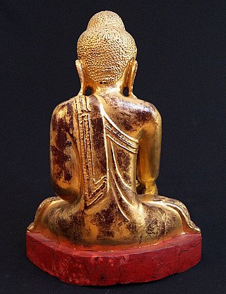 Mandalay Buddha statue in wood with gilding, rear view showing robe folds