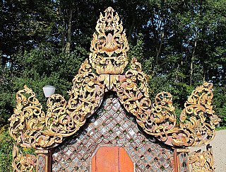 Top section of the Shan wooden wall panel, showing the gilded openwork carving