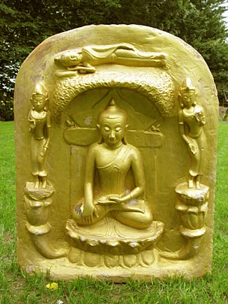 Wooden Buddha relief plaque from Burma (Myanmar) with seated Buddha and two attendants, front view
