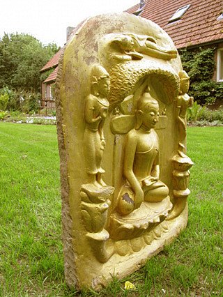 Seated Buddha relief plaque from Burma (Myanmar), three-quarter view showing the side edge